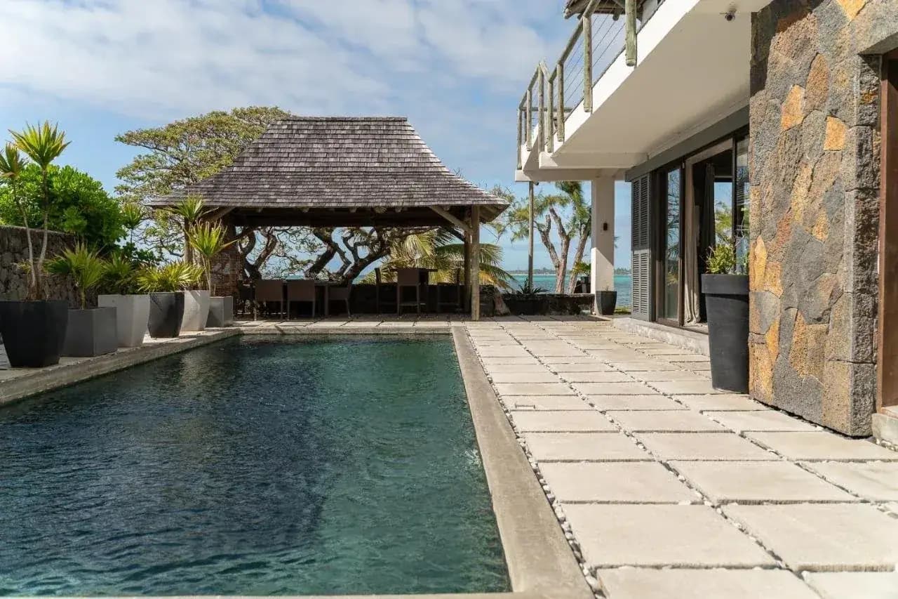Luxury beachfront villa with private pool and ocean views — property purchasing in Mauritius